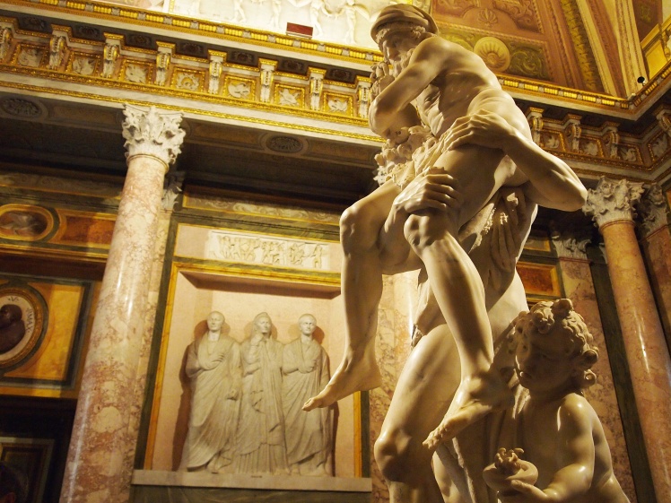 Aeneas carries his father, Anchises, and leads his son, Ascanius, out of Troy. They would go on to help in the foundation of Rome. Statue by Bernini. 
